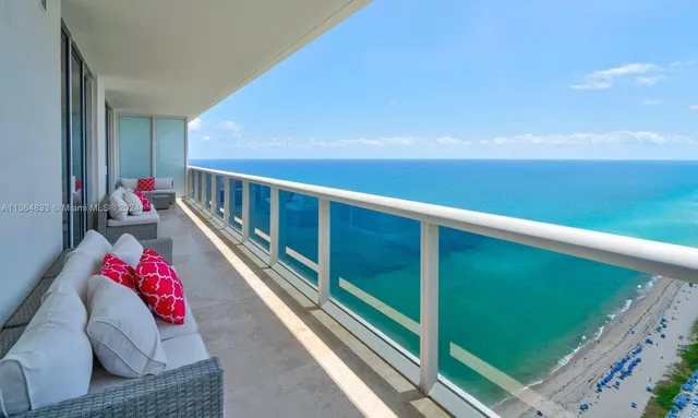 a view of balcony with furniture