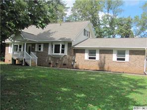 8267 Normandy Road Denver, NC 28037 - Photo 2 of 16 a front view of a house with a garden
