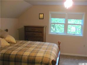 8267 Normandy Road Denver, NC 28037 - Photo 12 of 16 a bedroom with a bed and a window