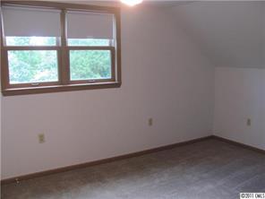 8267 Normandy Road Denver, NC 28037 - Photo 13 of 16 an empty room with a window