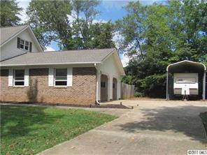 8267 Normandy Road Denver, NC 28037 - Photo 16 of 16 a front view of a house with a garden and yard
