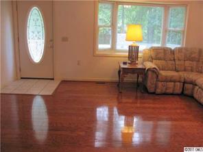 8267 Normandy Road Denver, NC 28037 - Photo 3 of 16 a living room with furniture and a window