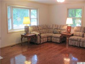 8267 Normandy Road Denver, NC 28037 - Photo 4 of 16 a living room with furniture and a window