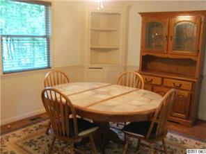 8267 Normandy Road Denver, NC 28037 - Photo 5 of 16 a view of a dining room with furniture and window
