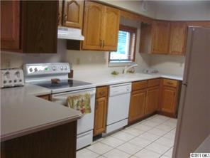 8267 Normandy Road Denver, NC 28037 - Photo 8 of 16 a kitchen with a sink a stove and cabinets