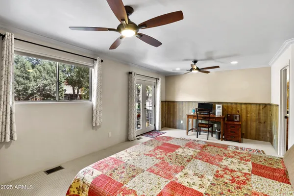 a bedroom with a bed dresser and a window