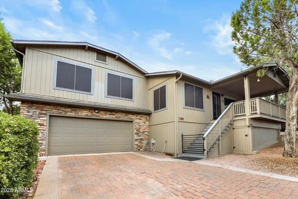 a front view of a house with garage