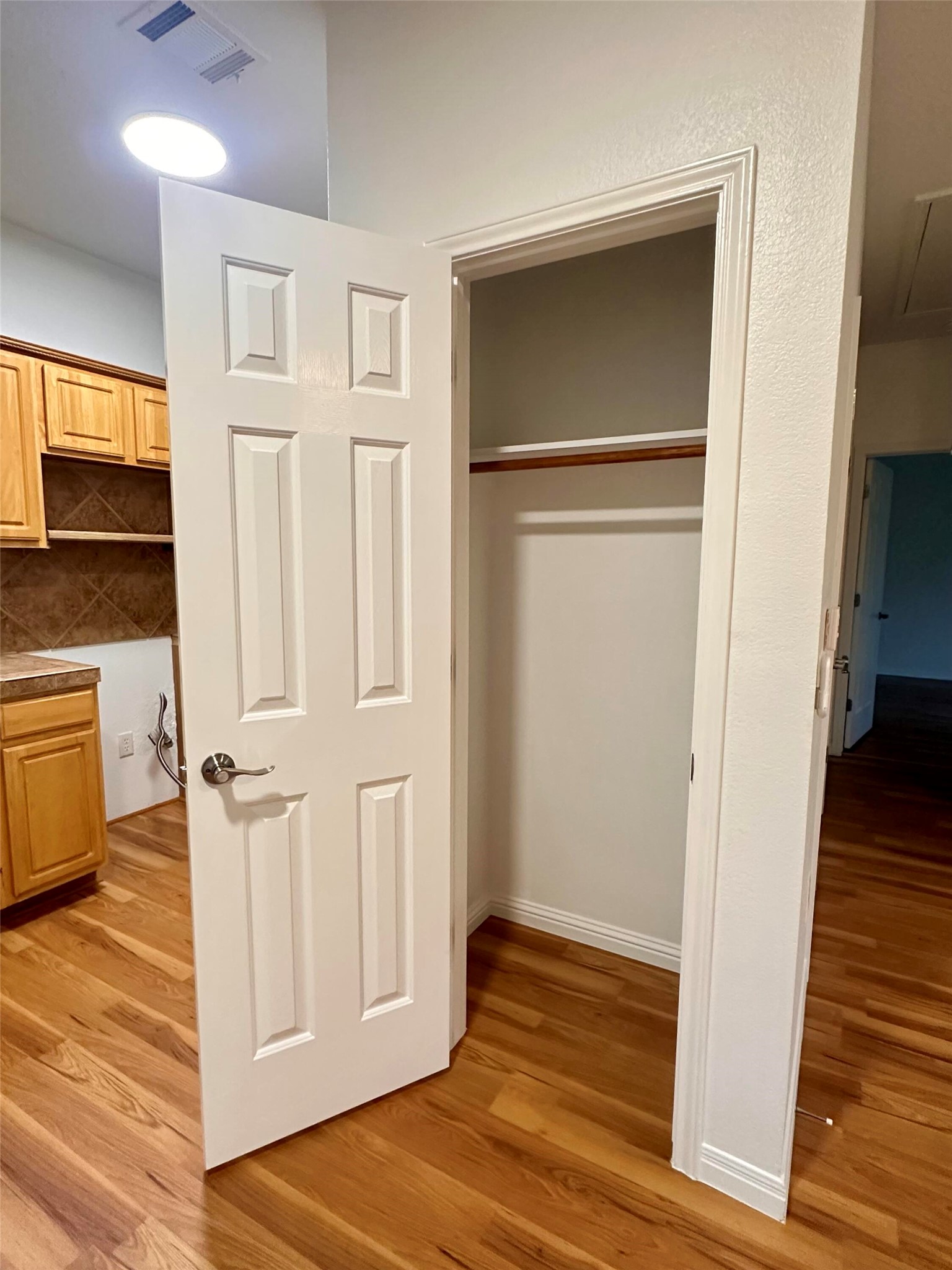 1122 Mansell Avenue Austin, TX 78721 - Photo 9 of 29 a view of a hallway with wooden floor and staircase