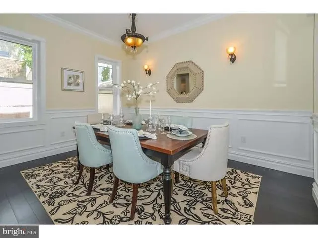 a kitchen with stainless steel appliances kitchen island granite countertop a stove top oven a sink a counter space and cabinets