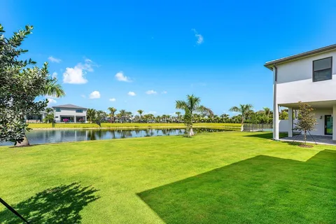 a view of a swimming pool with an outdoor space and seating area