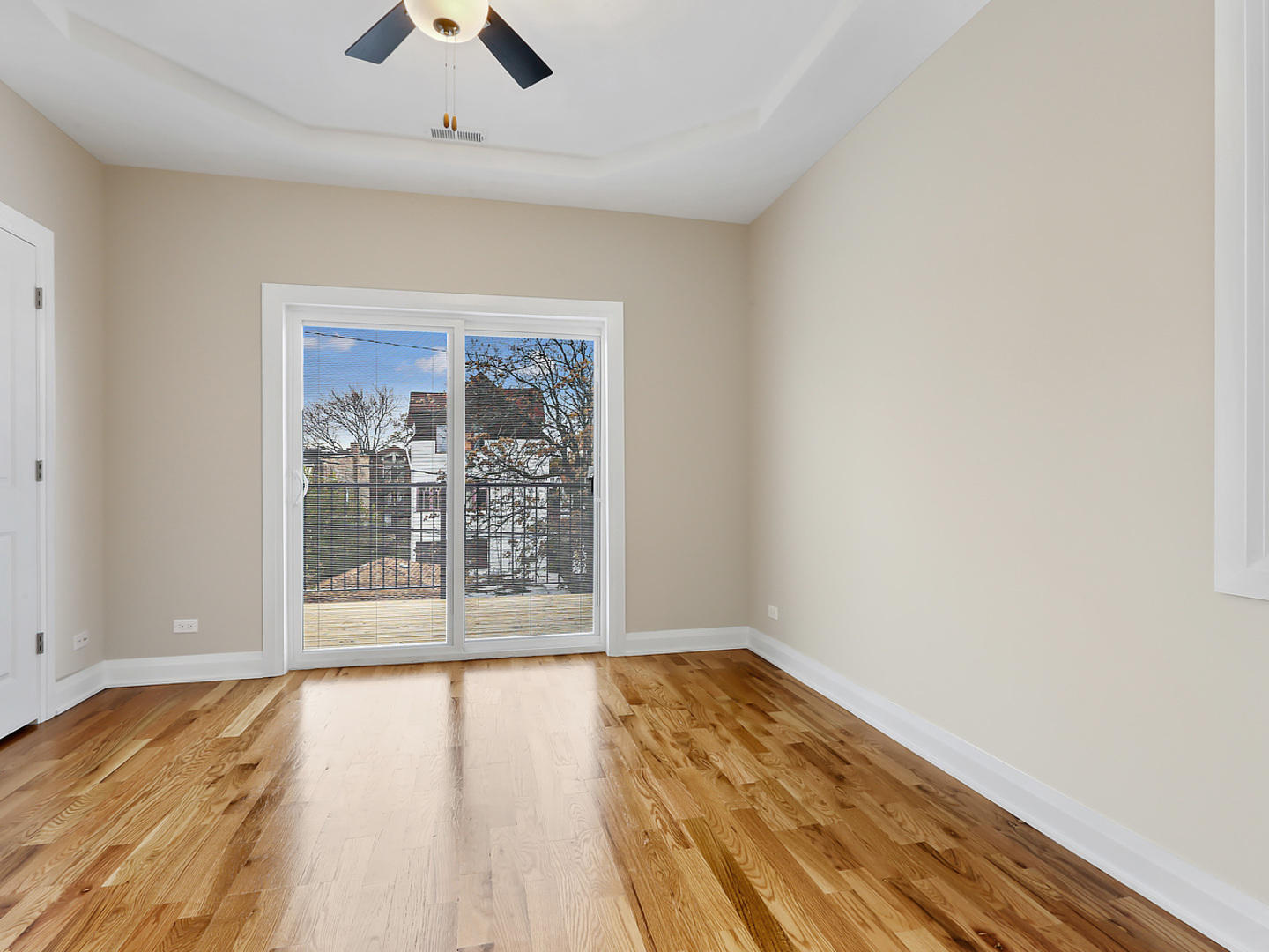 5939 West Superior Street, Unit 1 Chicago, IL 60644 - Photo 7 of 12 wooden floor in an empty room with a window