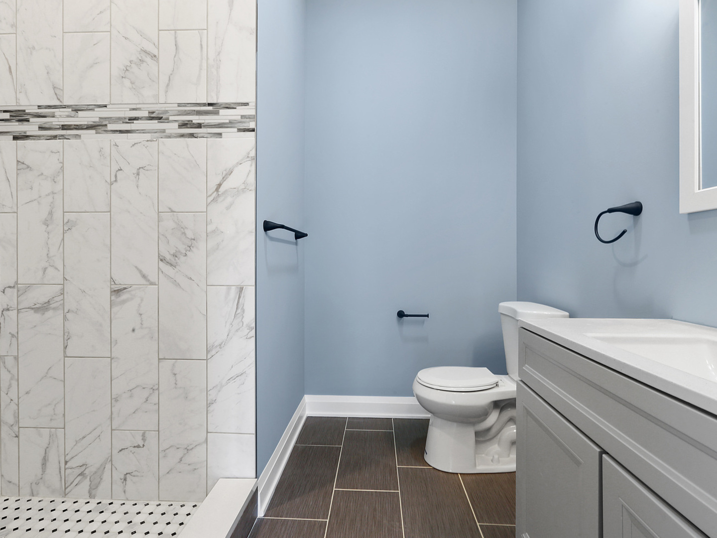 5939 West Superior Street, Unit 1 Chicago, IL 60644 - Photo 9 of 12 a bathroom with a toilet and a shower