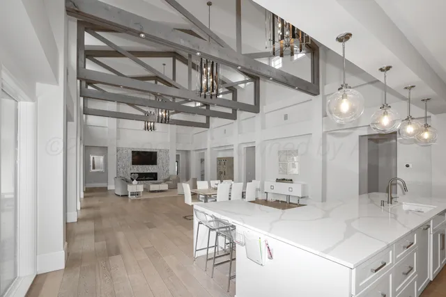 a view of a chair and table in backyard of the house