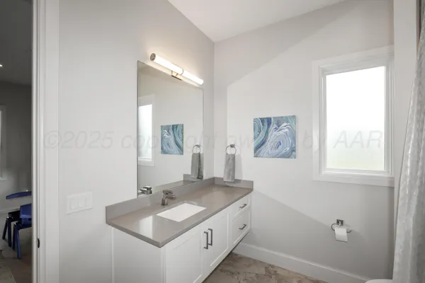 a large living room with stainless steel appliances kitchen island granite countertop furniture and a couch