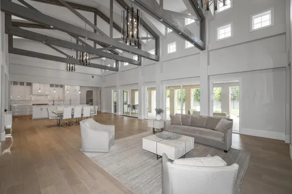 a living room with stainless steel appliances kitchen island granite countertop furniture and a kitchen view