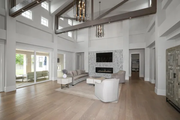 a large white kitchen with cabinets