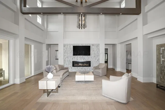 a living room with hard wood floors and a couch