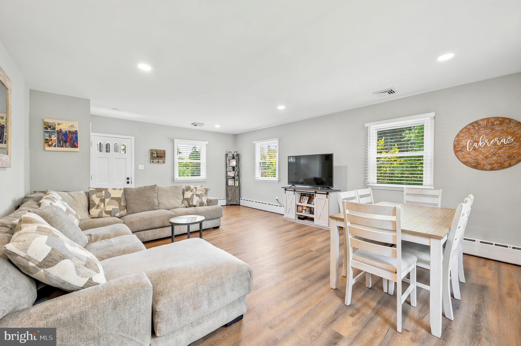 211 North Sylvania Avenue Jenkintown, PA 19046 - Photo 6 of 17 a living room with furniture a flat screen tv and a window