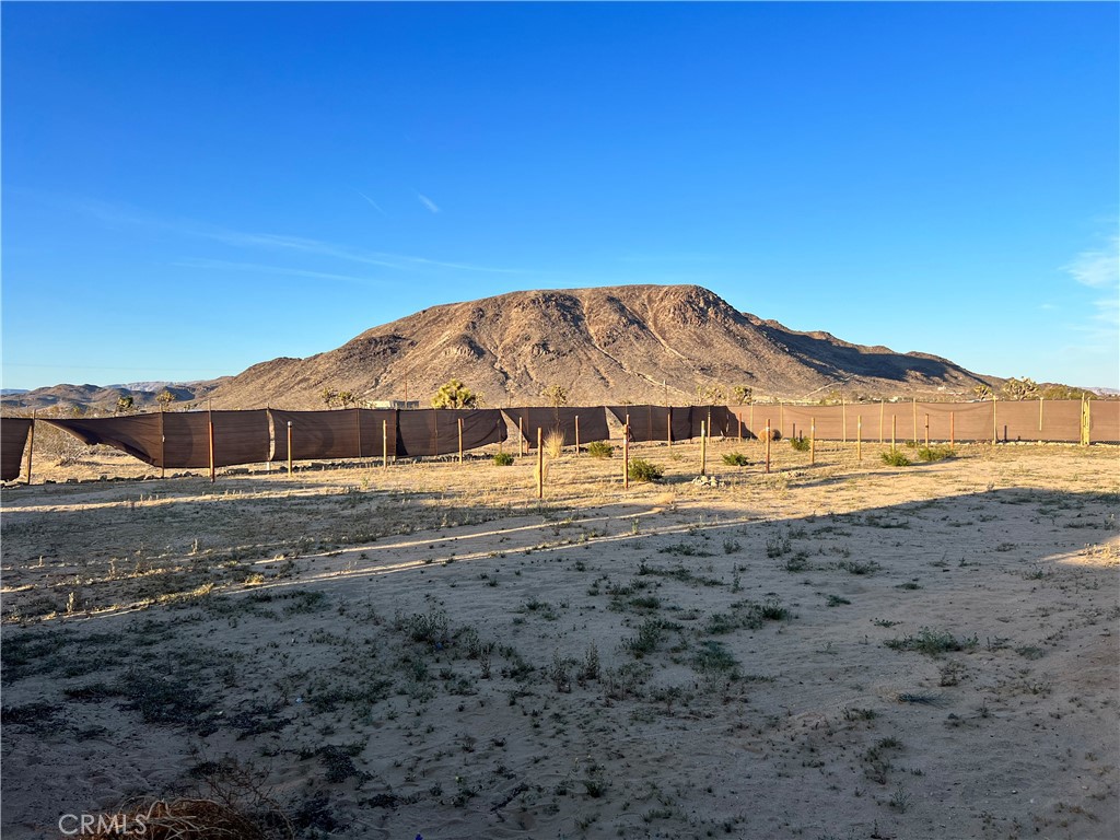 a view of a large house with a mountain