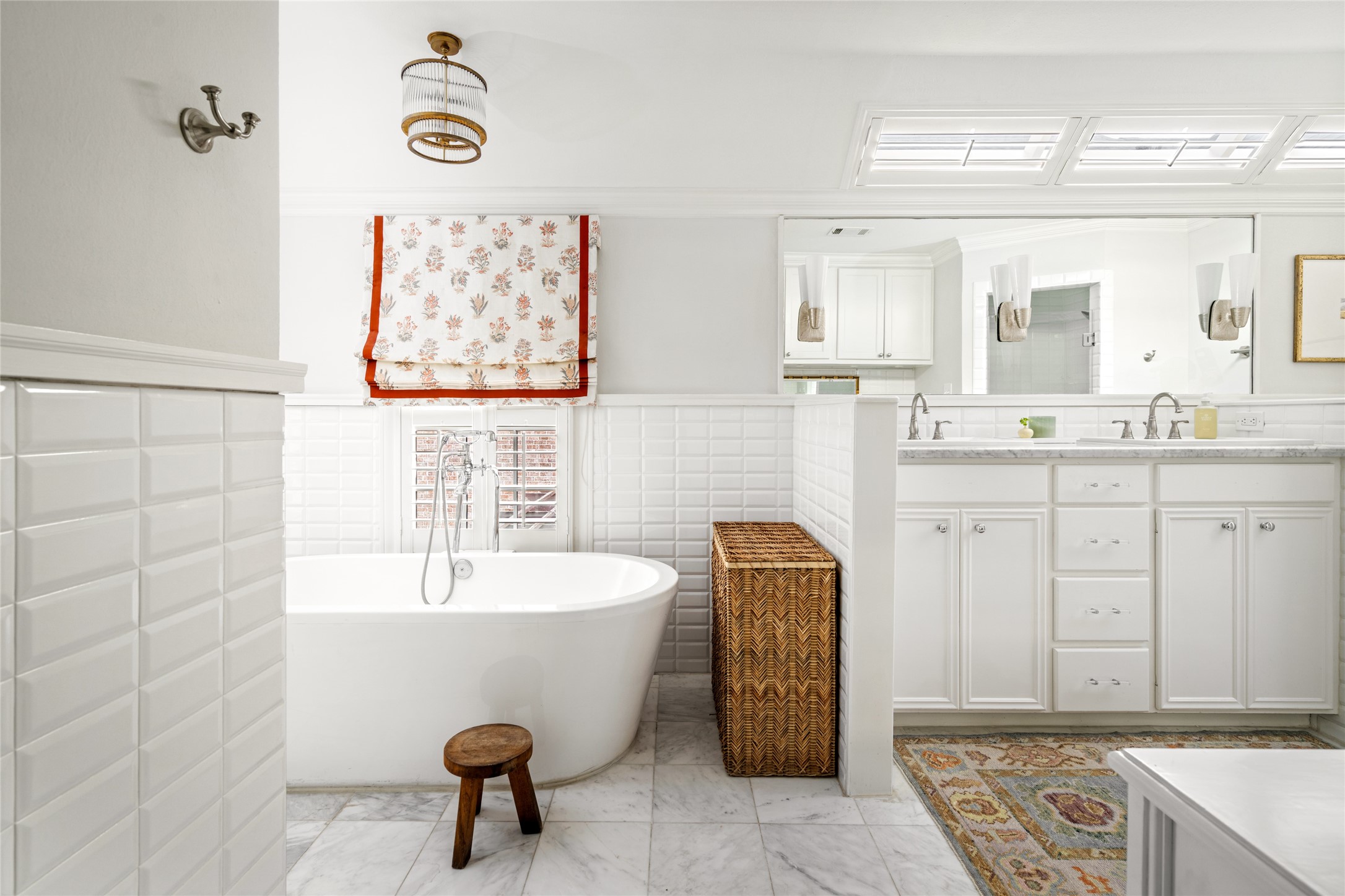 3784 Ingold Street Houston, TX 77005 - Photo 37 of 50 Primary bathroom is a dream with dual sink spaces, large shower and soaking tub. Enjoy natural light through roof windows without sacrificing privacy.