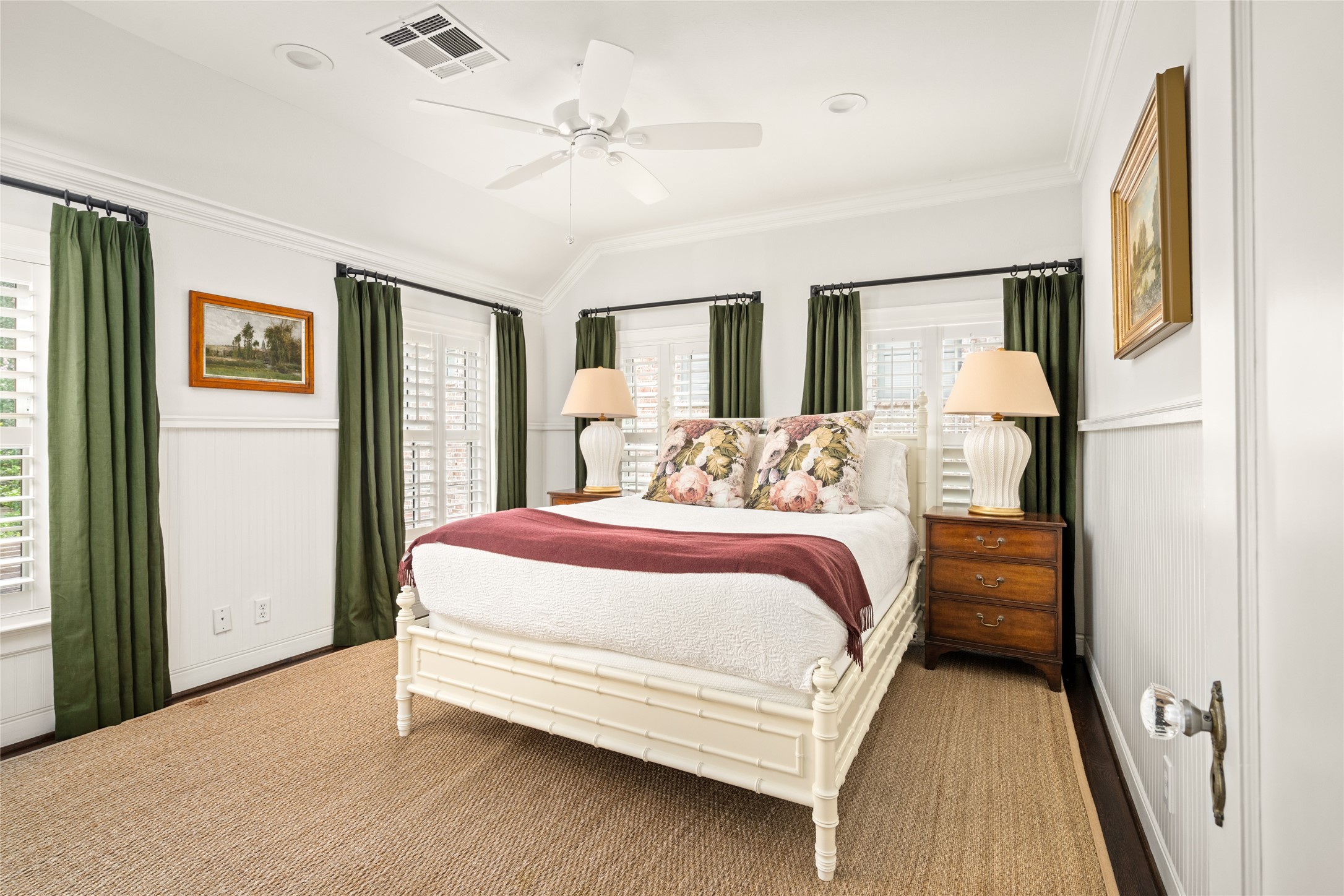3784 Ingold Street Houston, TX 77005 - Photo 40 of 50 Secondary bedroom 3 is comfortable with window shutters and deep green drapery panels adorning the windows.