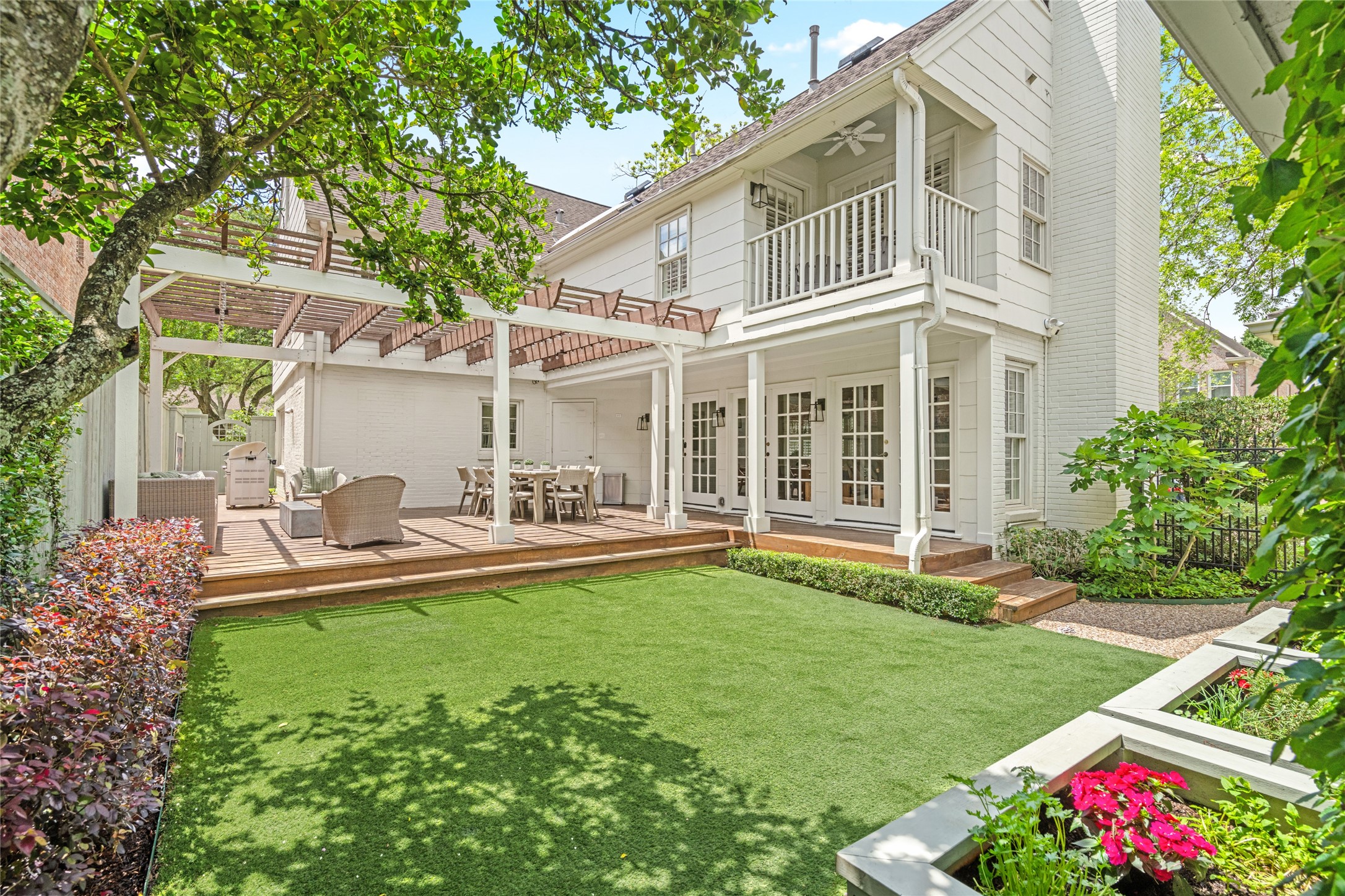 3784 Ingold Street Houston, TX 77005 - Photo 44 of 50 Backyard is spacious and turfed with a deck space for dining and relaxing.