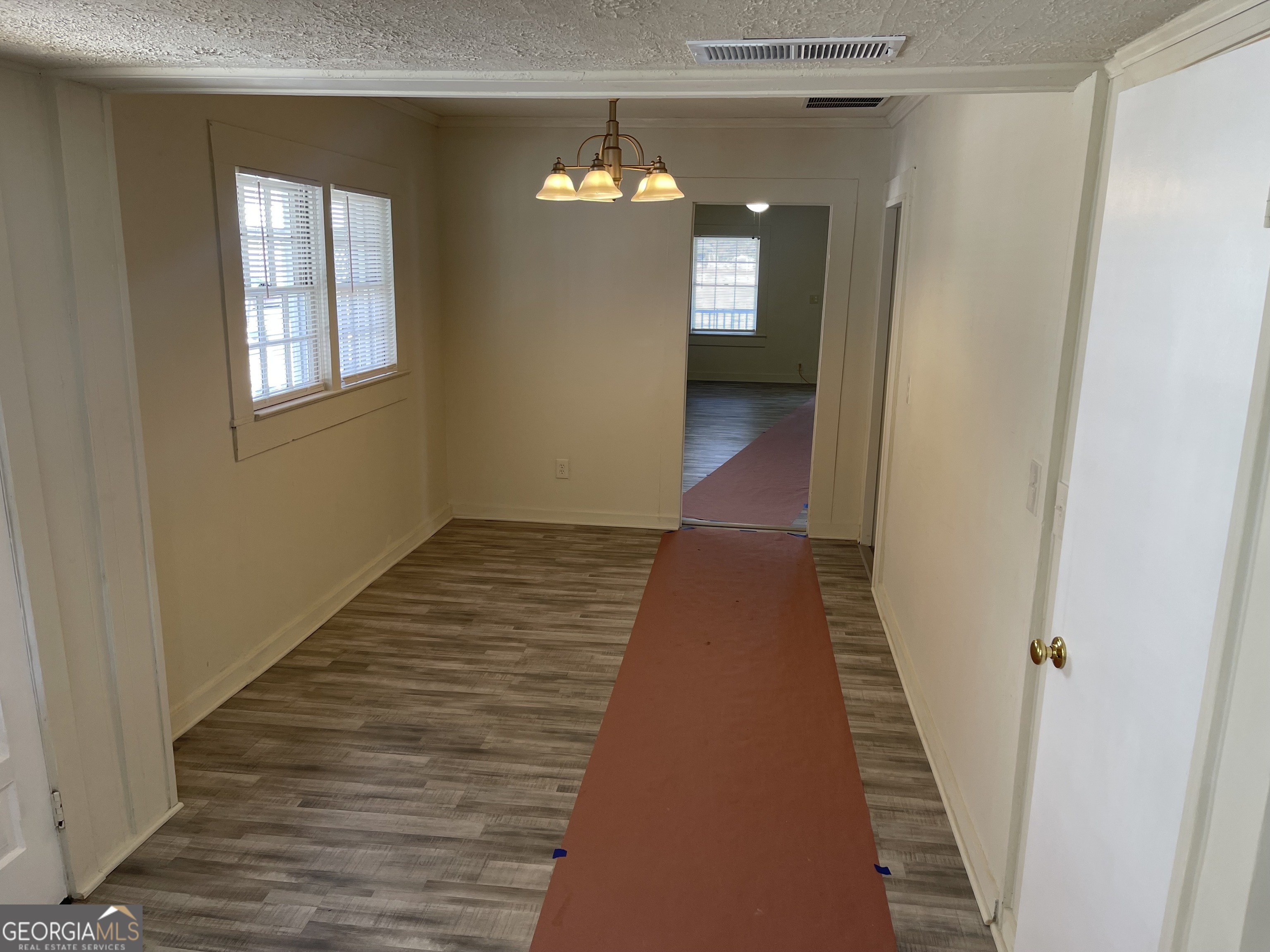 478 South Pond Street Toccoa, GA 30577 - Photo 11 of 46 a view of a hallway with wooden floor and staircase