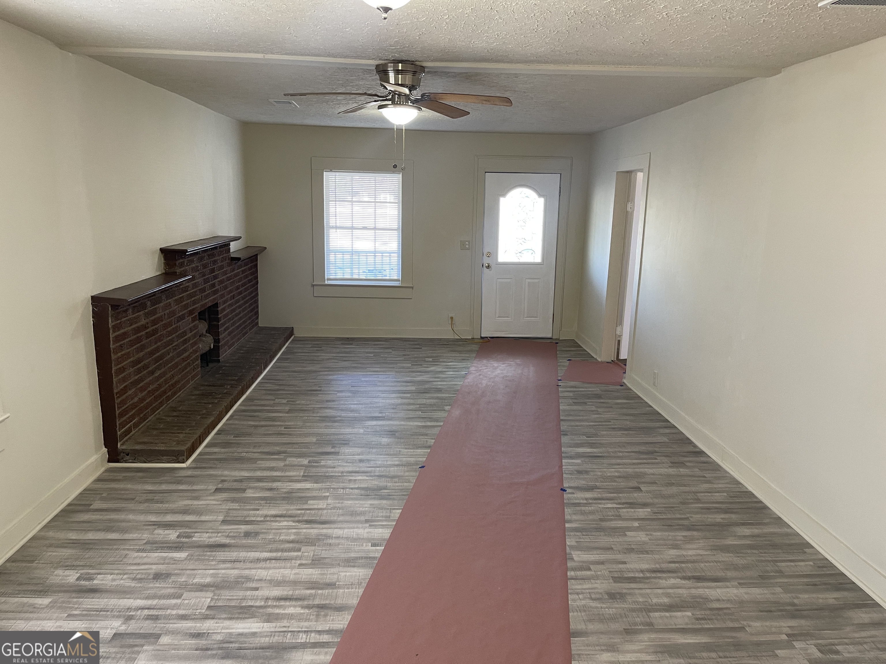 478 South Pond Street Toccoa, GA 30577 - Photo 12 of 46 wooden floor in an empty room with a window