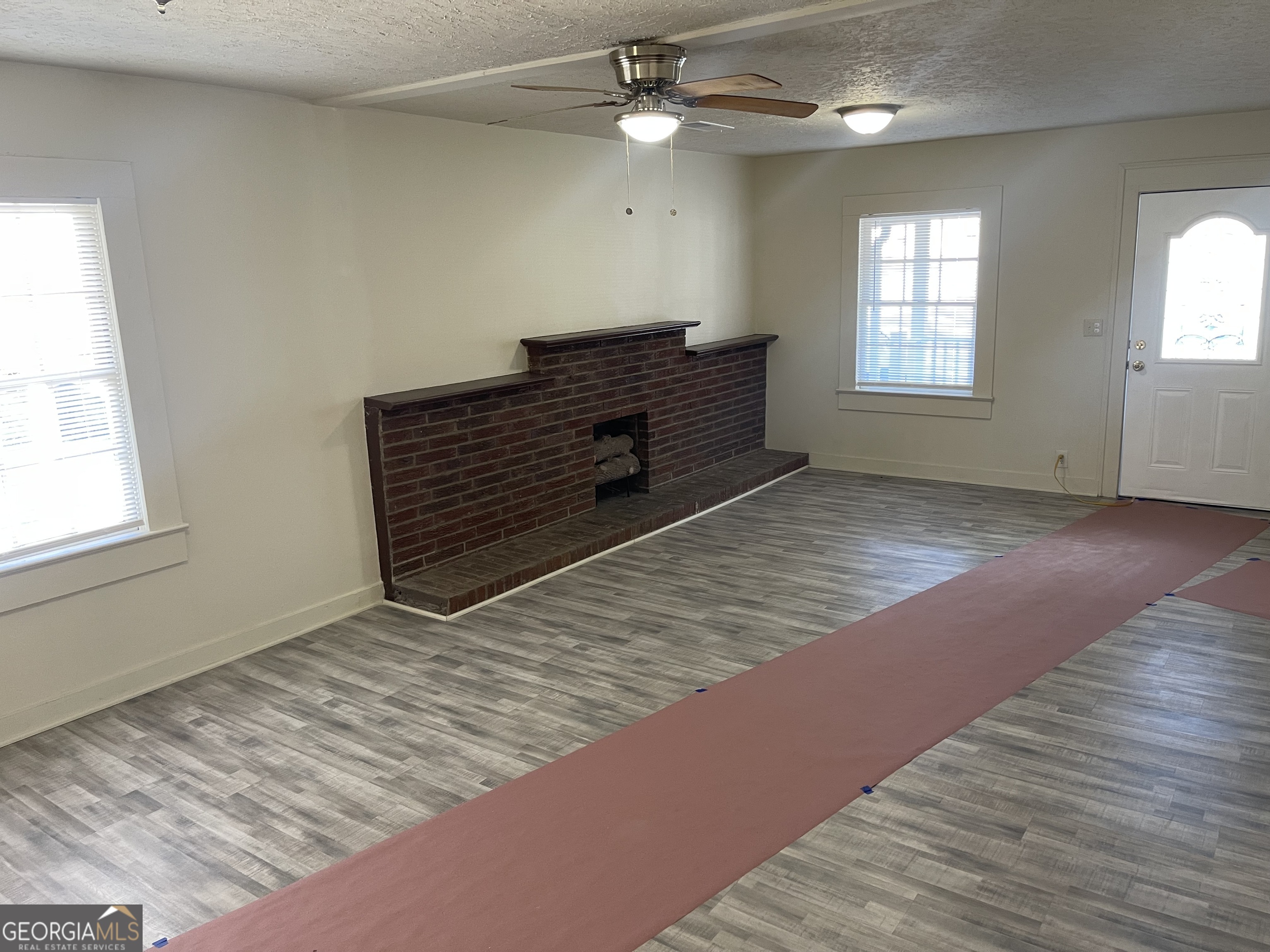 478 South Pond Street Toccoa, GA 30577 - Photo 14 of 46 wooden floor in an empty room with a window