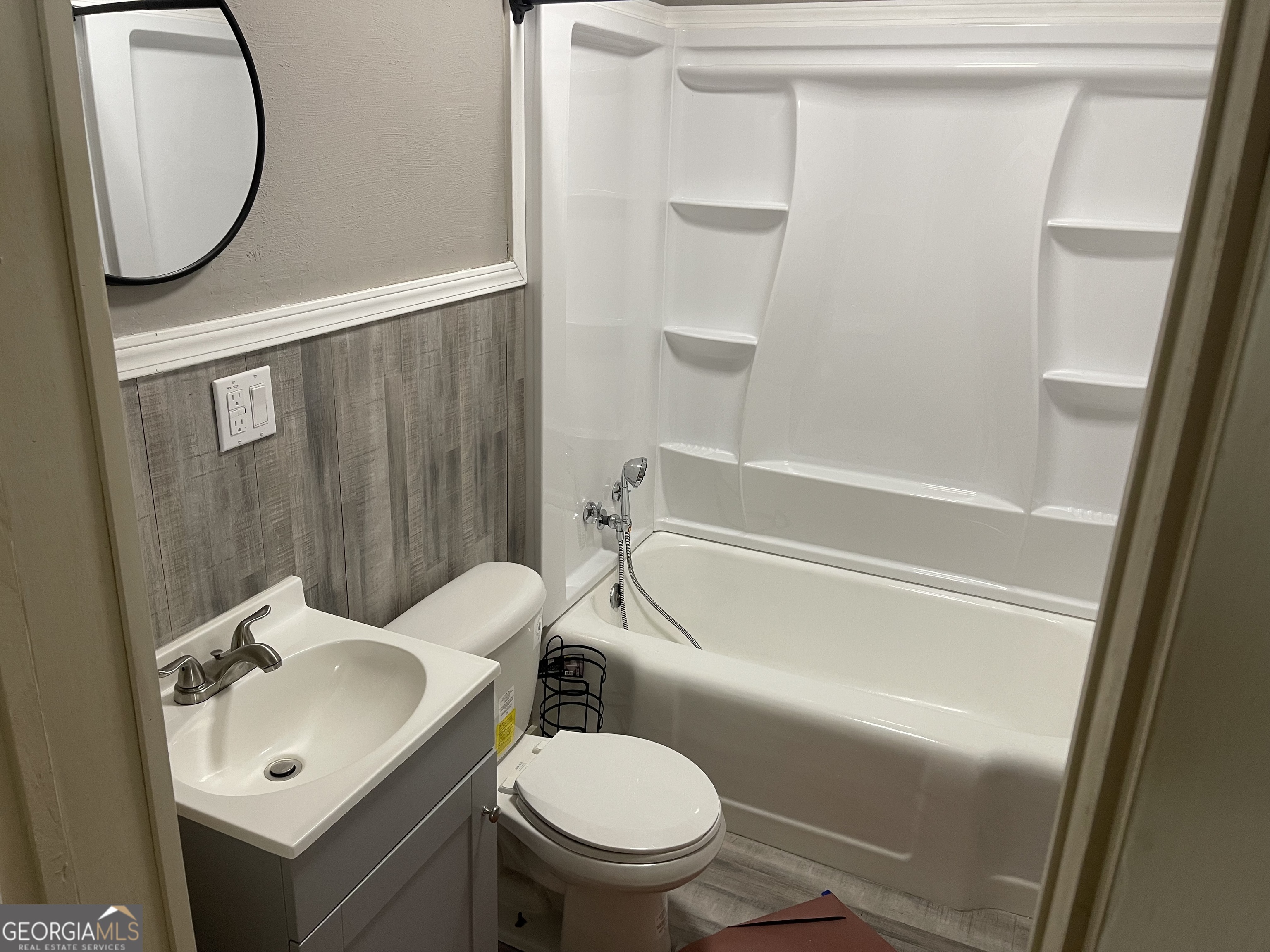 478 South Pond Street Toccoa, GA 30577 - Photo 17 of 46 a bathroom with a sink toilet and a mirror