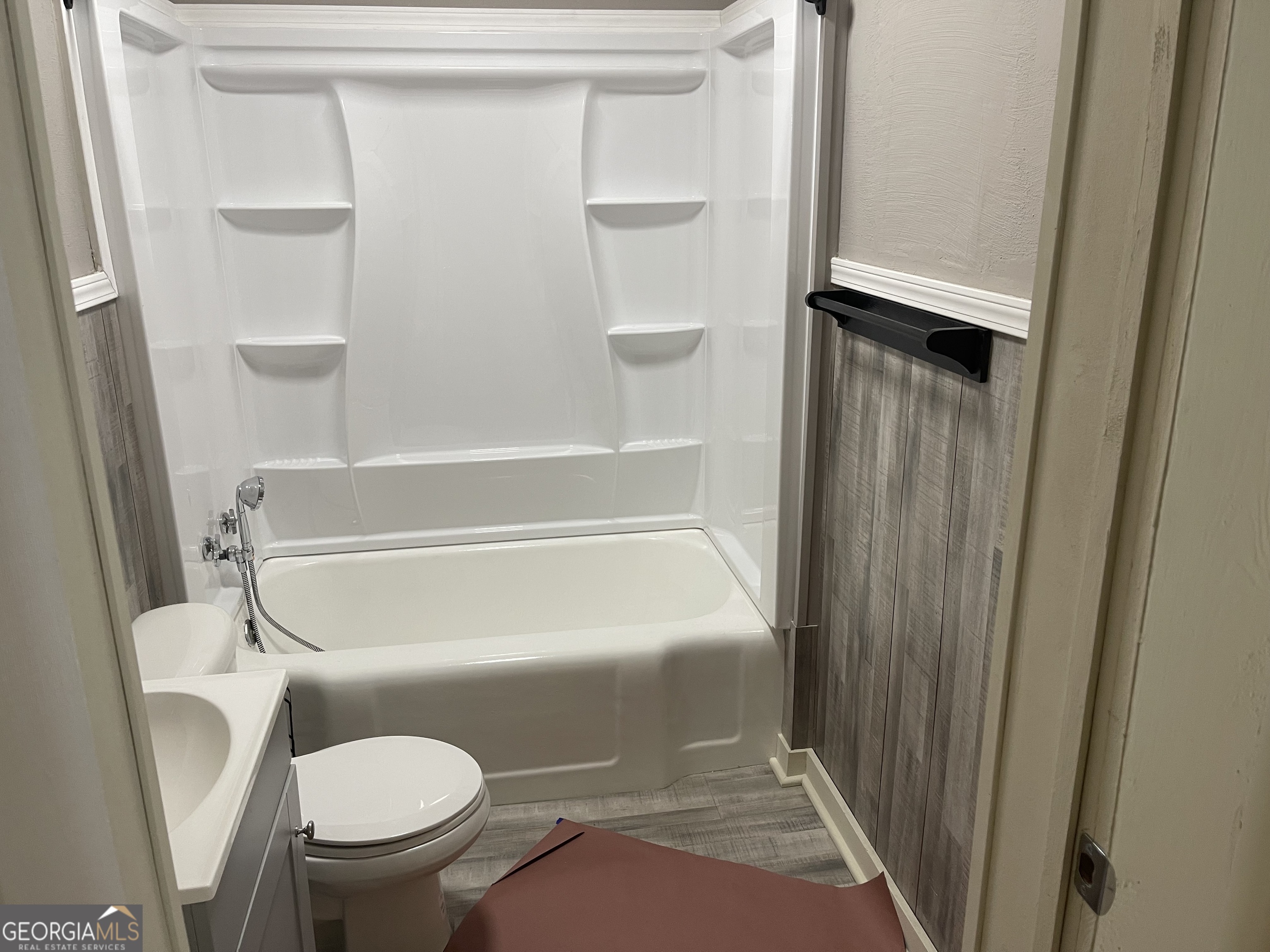 478 South Pond Street Toccoa, GA 30577 - Photo 18 of 46 a bathroom with a toilet and a shower