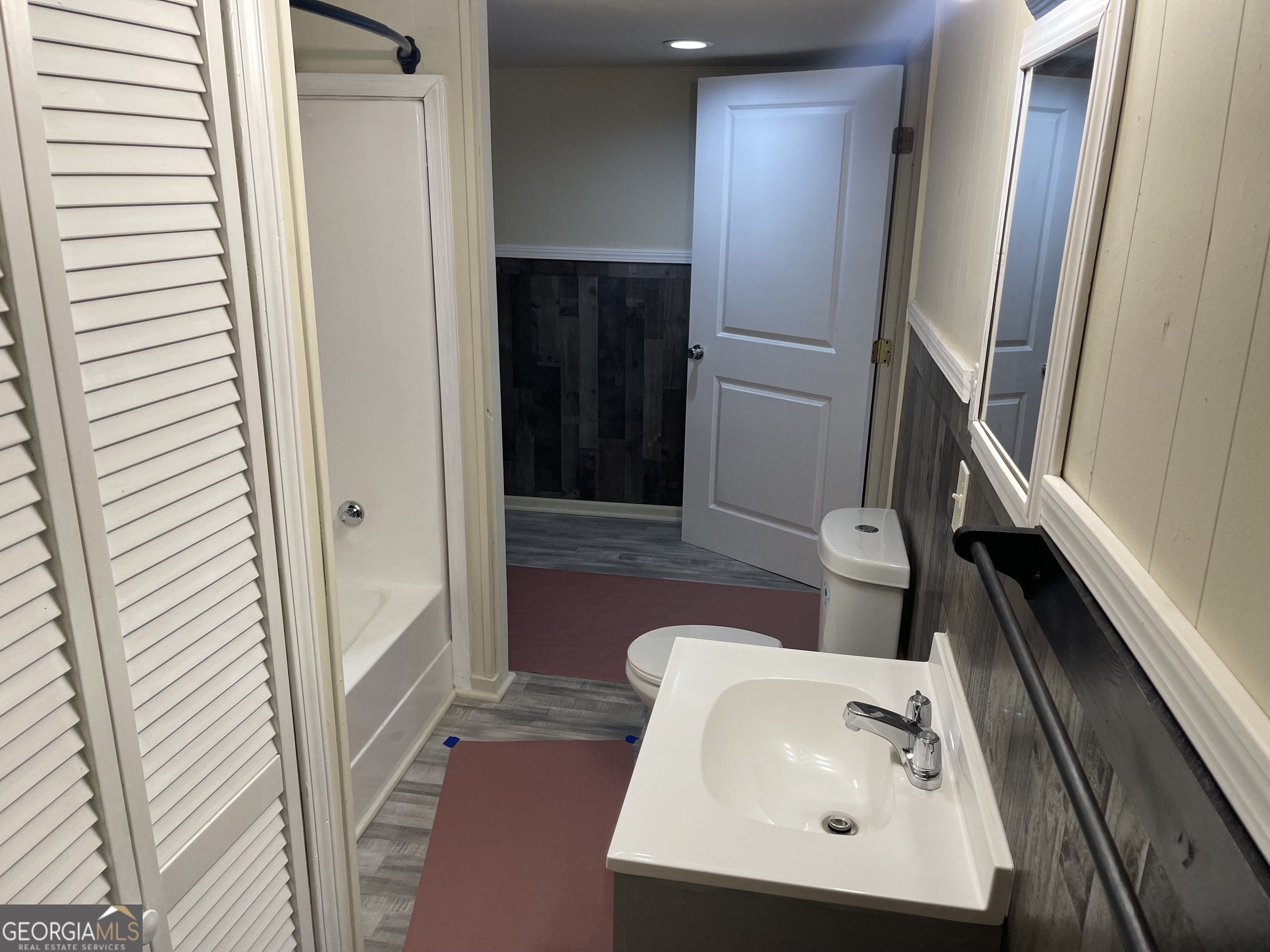 478 South Pond Street Toccoa, GA 30577 - Photo 21 of 46 a bathroom with a sink and mirror