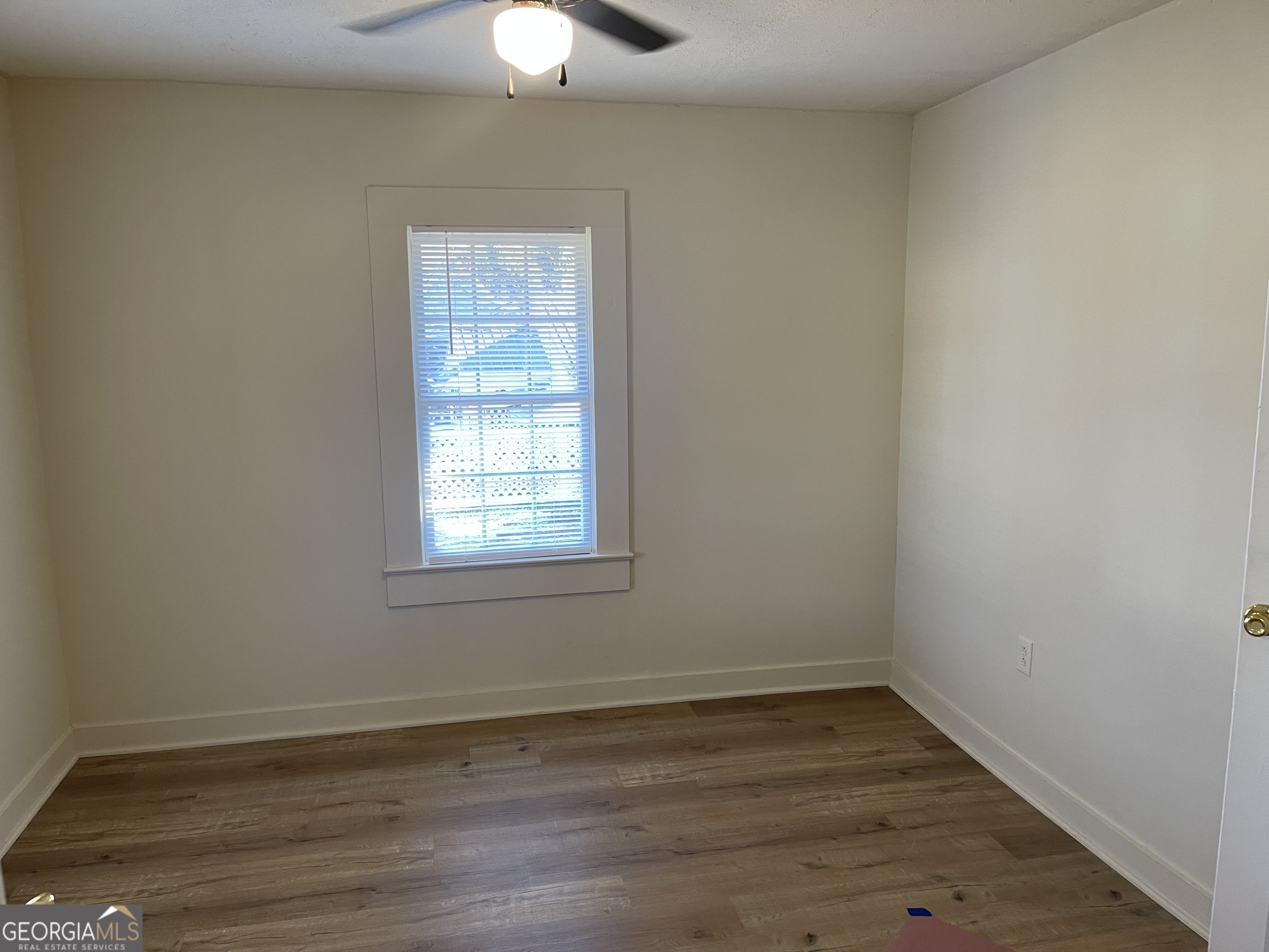 478 South Pond Street Toccoa, GA 30577 - Photo 26 of 46 wooden floor in an empty room with a window