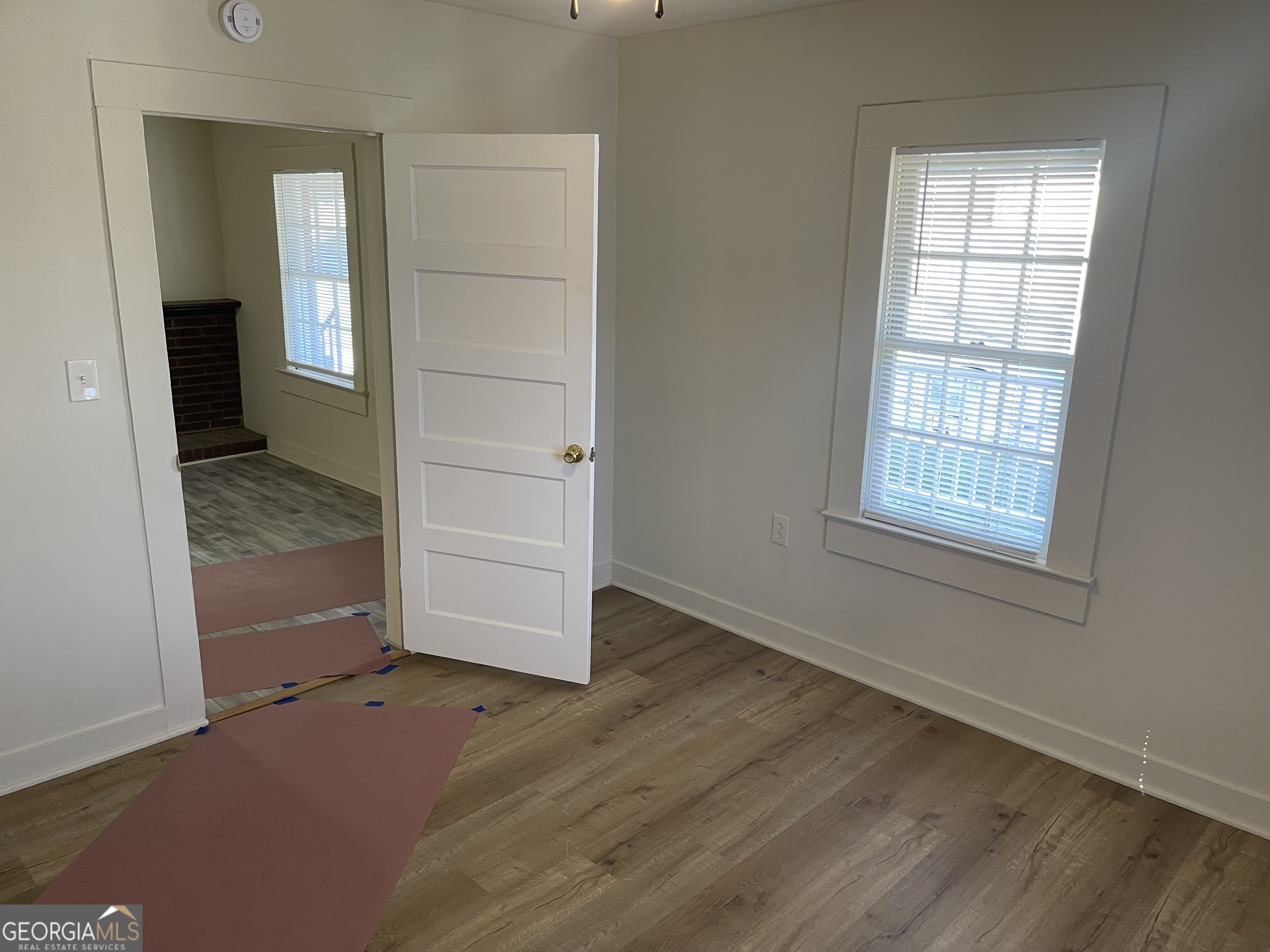 478 South Pond Street Toccoa, GA 30577 - Photo 27 of 46 an empty room with wooden floor closet and windows