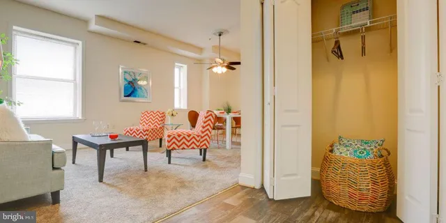 a living room with patio furniture and a window