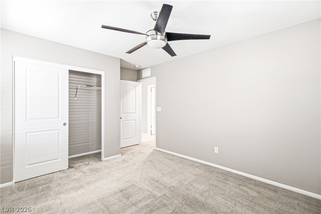 2834 Turnstone Ridge Street Henderson, NV 89044 - Photo 13 of 22 Soft carpeting underfoot defines this comfortable bedroom layout.