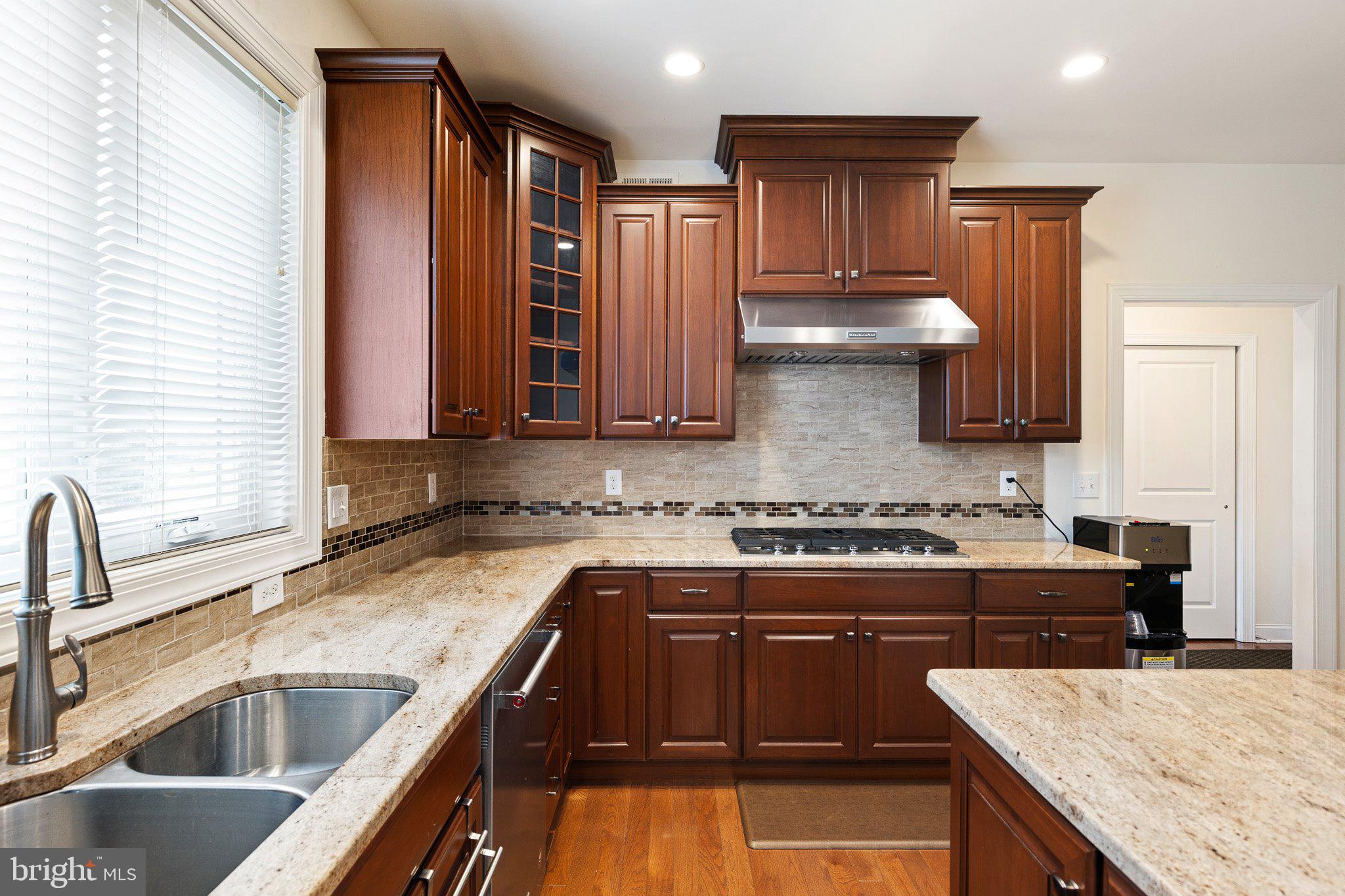 1020 Matthew Way New Castle, DE 19720 - Photo 11 of 55 a kitchen with stainless steel appliances granite countertop a sink stove and refrigerator
