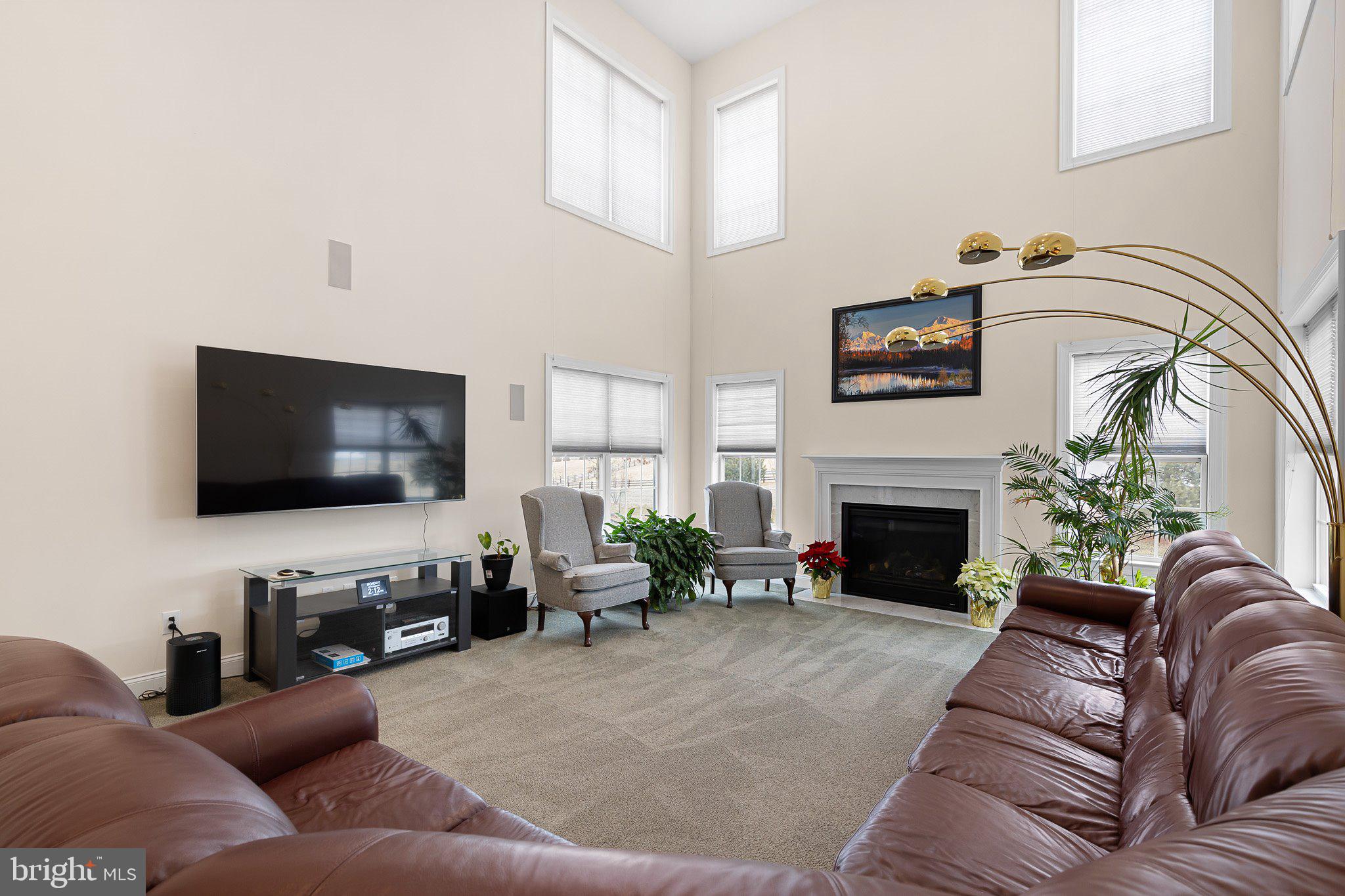 1020 Matthew Way New Castle, DE 19720 - Photo 15 of 55 a living room with furniture and a flat screen tv