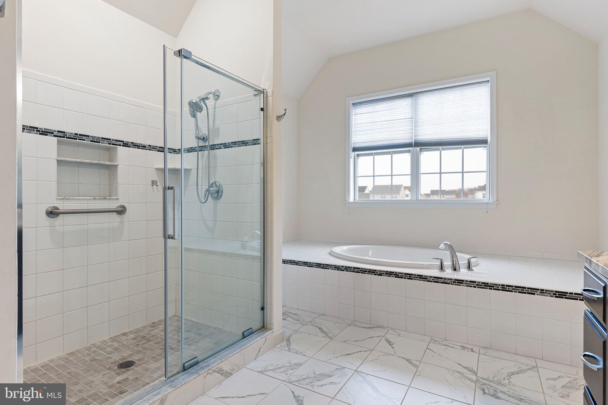 1020 Matthew Way New Castle, DE 19720 - Photo 29 of 55 a bathroom with a bathtub and a shower