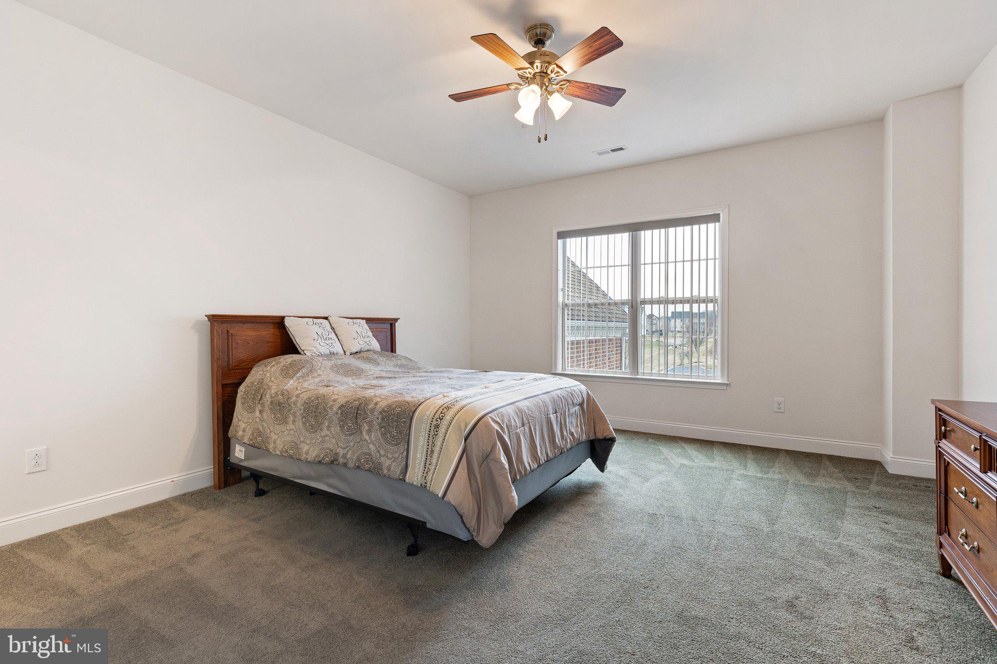 1020 Matthew Way New Castle, DE 19720 - Photo 34 of 55 a spacious bedroom with a bed and a window