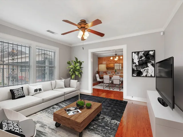 a living room with furniture and a flat screen tv