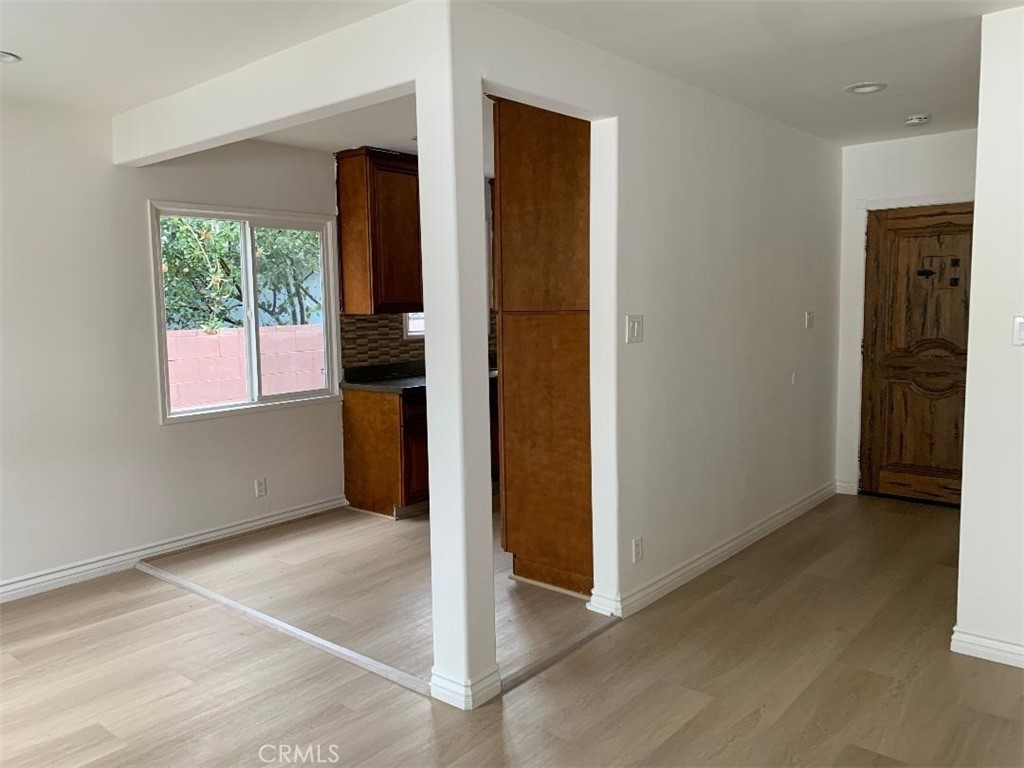 18233 Welby Way Reseda, CA 91335 - Photo 2 of 15 an empty room with windows and closet