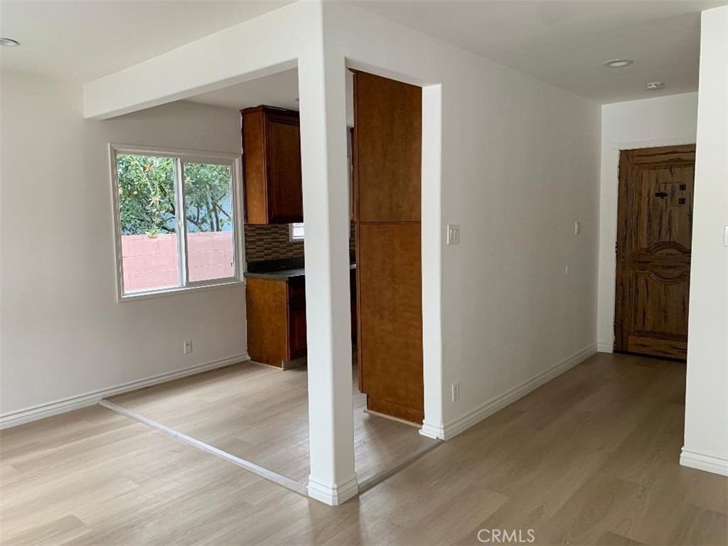 18233 Welby Way Reseda, CA 91335 - Photo 3 of 15 an empty room with windows and closet