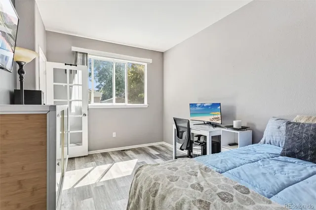 a bedroom with a bed and a table in it