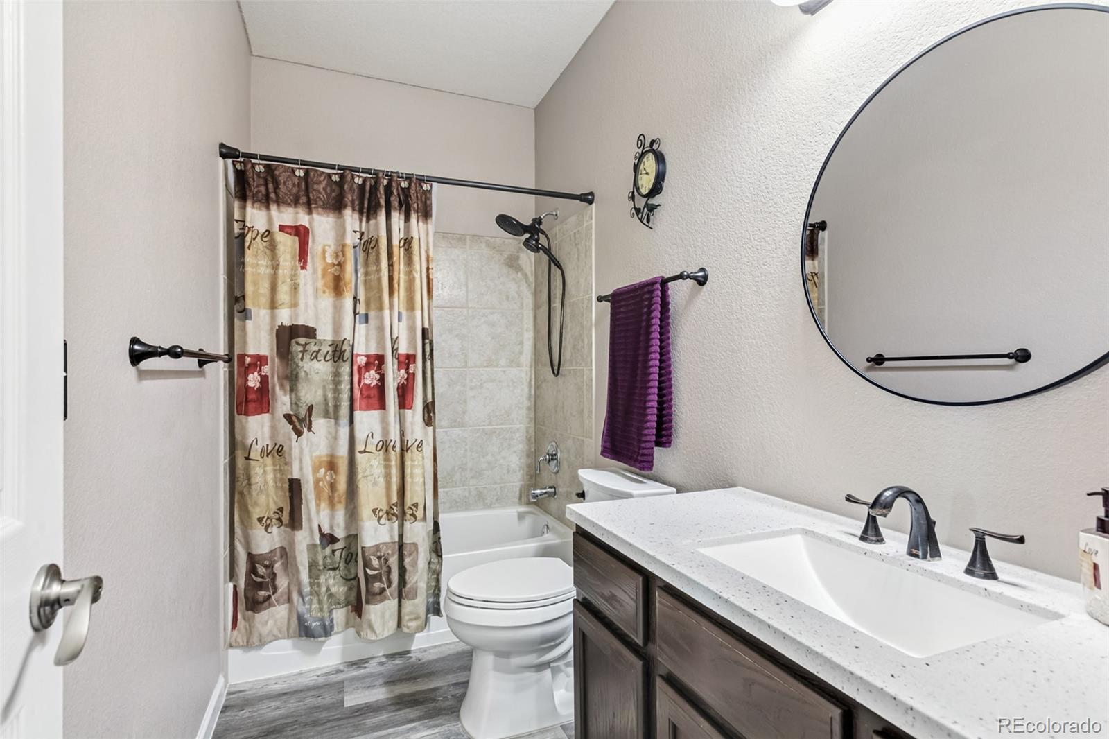 334 Octillo Street Brighton, CO 80601 - Photo 15 of 39 a bathroom with a sink vanity mirror and toilet