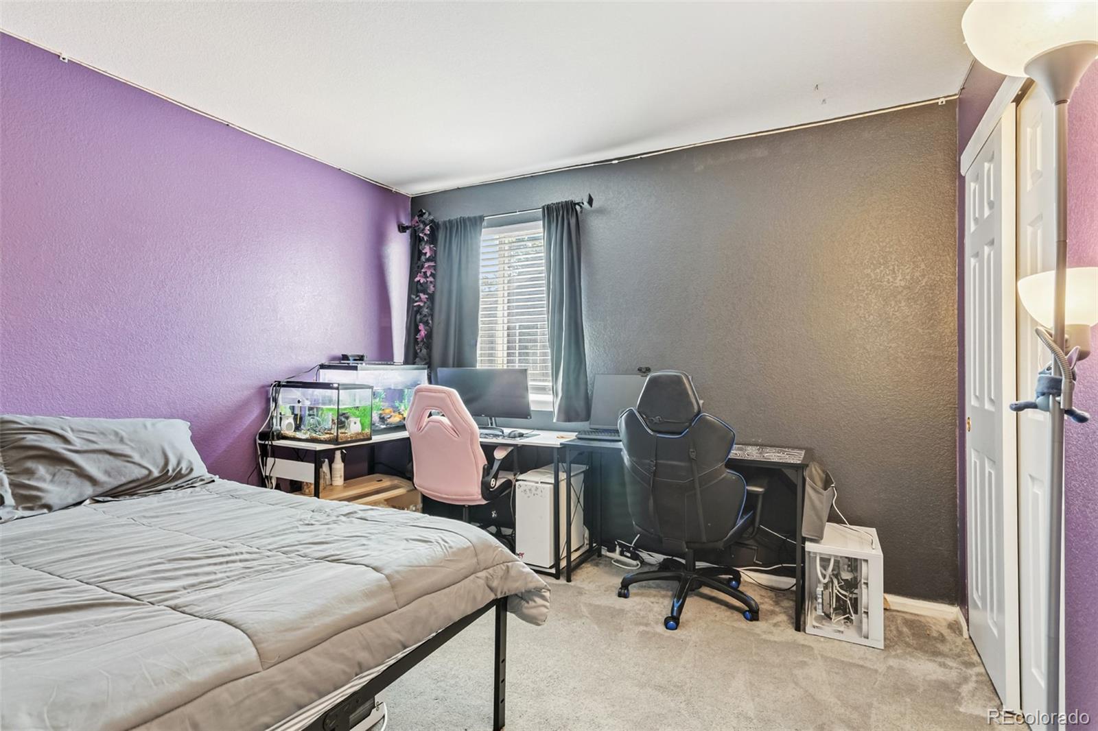 334 Octillo Street Brighton, CO 80601 - Photo 23 of 39 a bedroom with a bed and chair