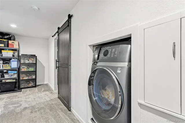a view of a storage & utility room with washer and dryer