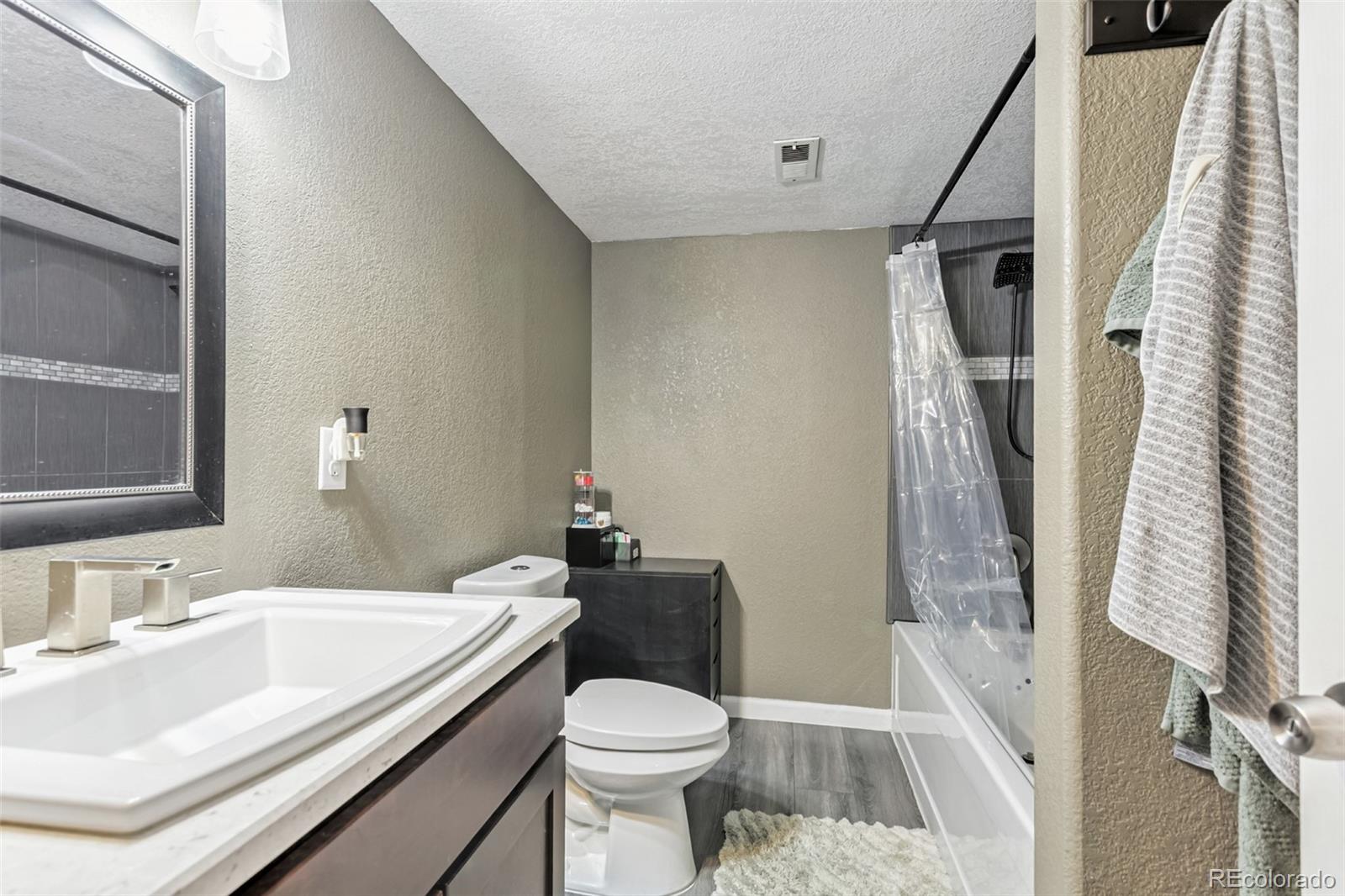 334 Octillo Street Brighton, CO 80601 - Photo 34 of 39 a bathroom with a sink toilet and shower