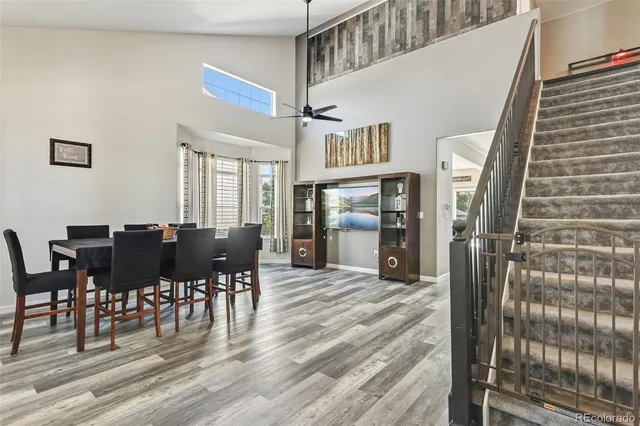 a view of a dining room with furniture window and wooden floor