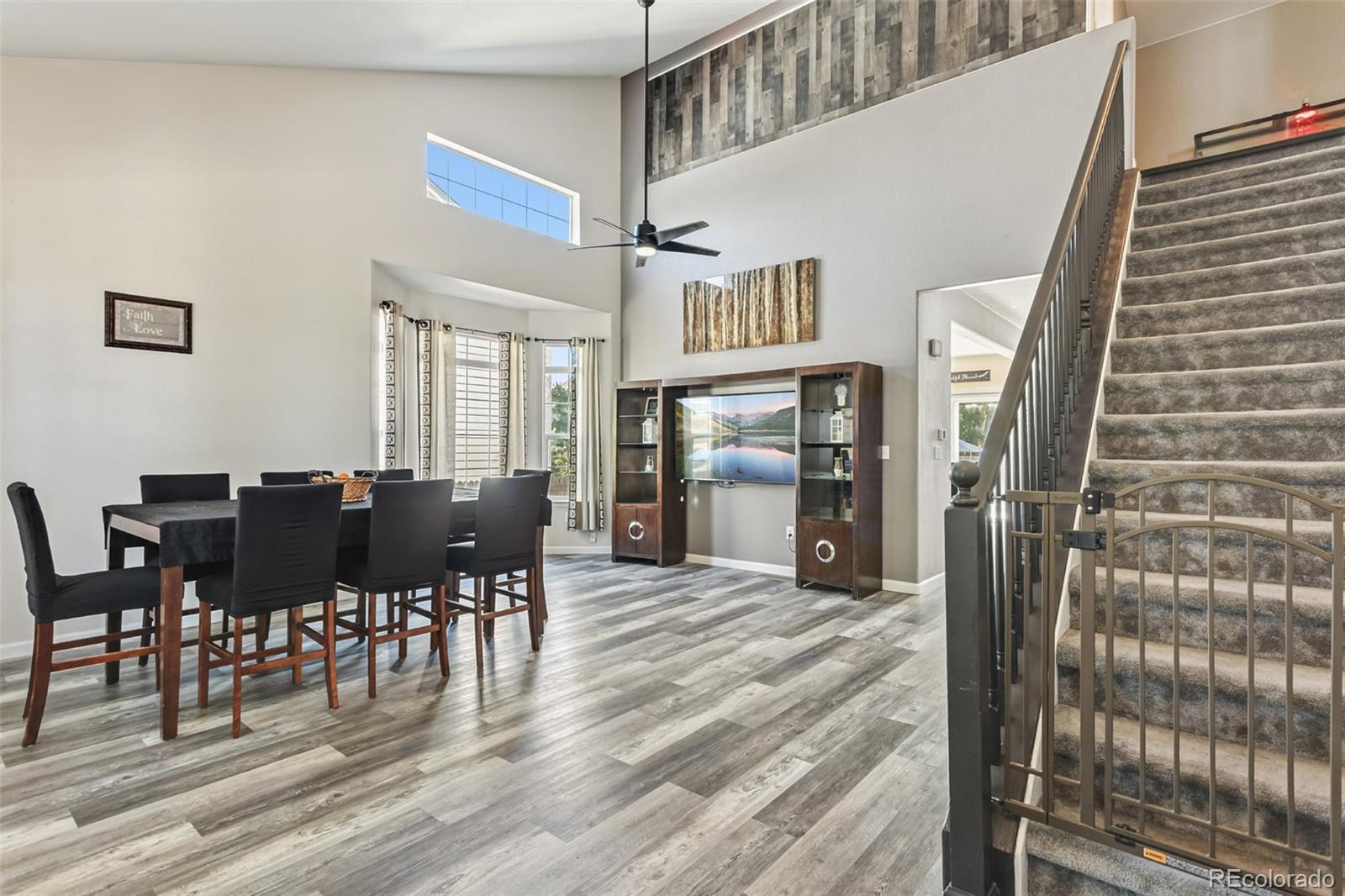 334 Octillo Street Brighton, CO 80601 - Photo 5 of 39 a view of a dining room with furniture window and wooden floor